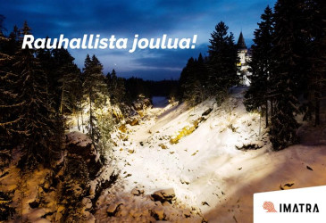 Imatrankosken uoma iltavalaistuksessa, kuvassa teksti Rauhallista joulua ja Imatran kaupungin tunnus.
