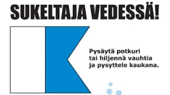 Sinivalkoinen A-lippu kertoo sukeltajasta vedessä.